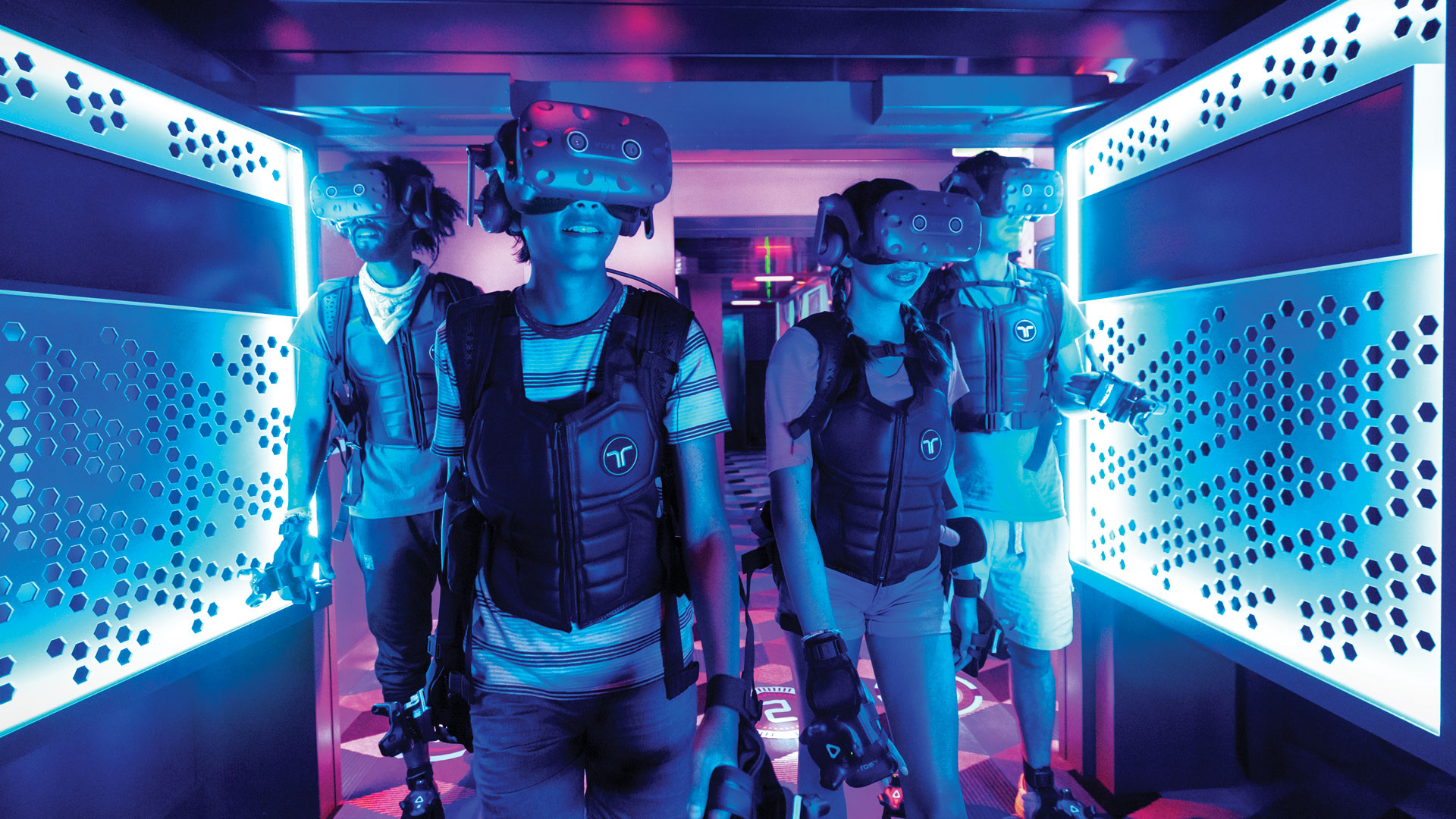 Image players wearing VR and haptic gear